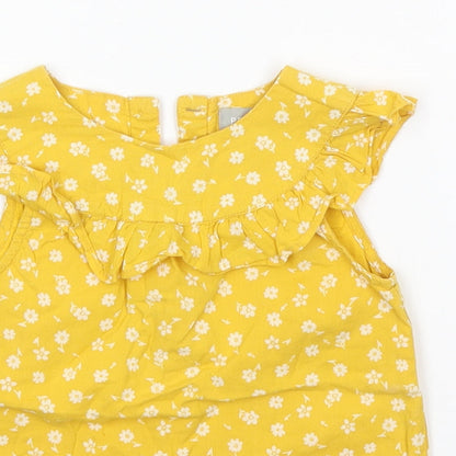 Close-up detail of Primark boys’ yellow a-line, size 24, months