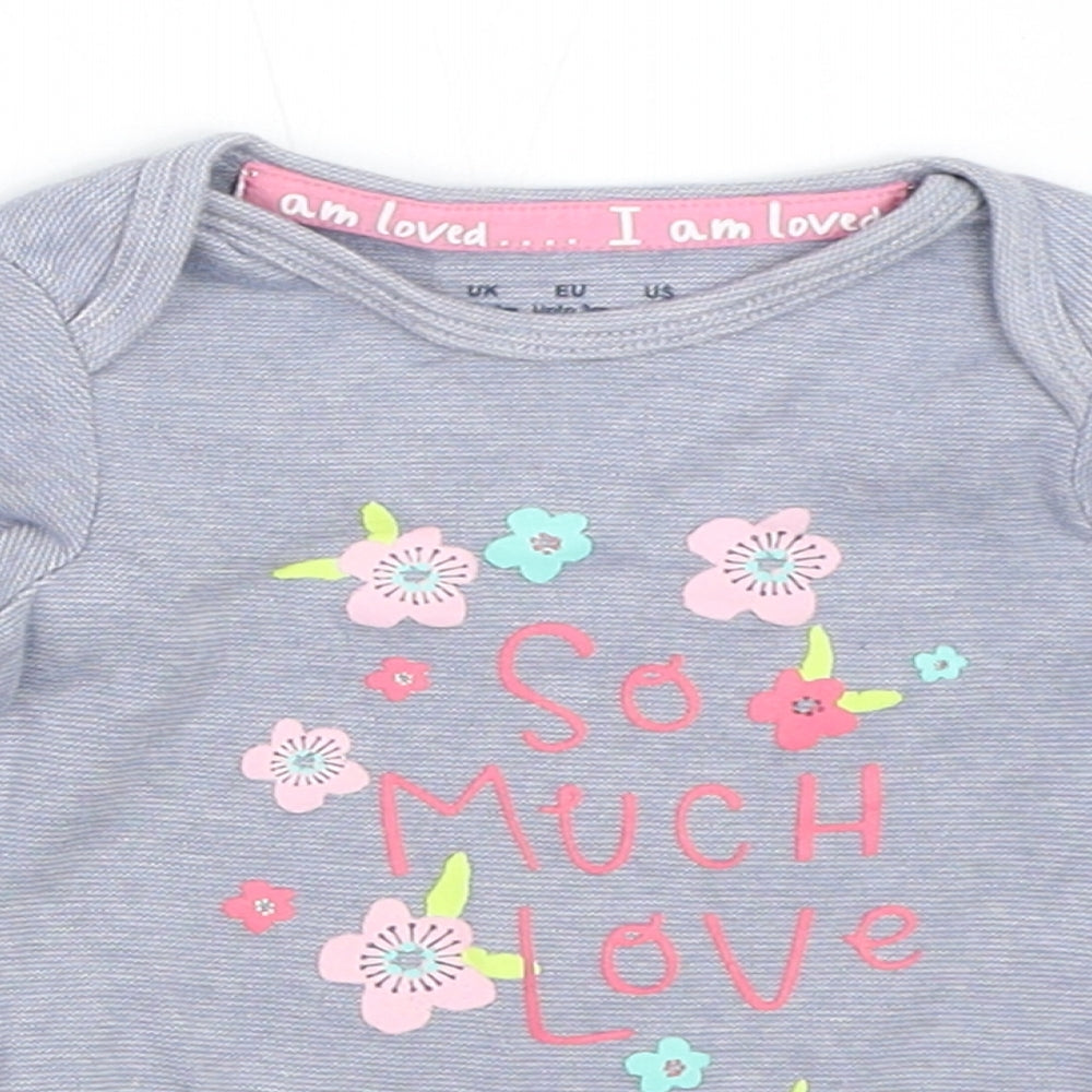 Close-up detail of F&F girls’ blue babygrow one-piece, size 0-3, months