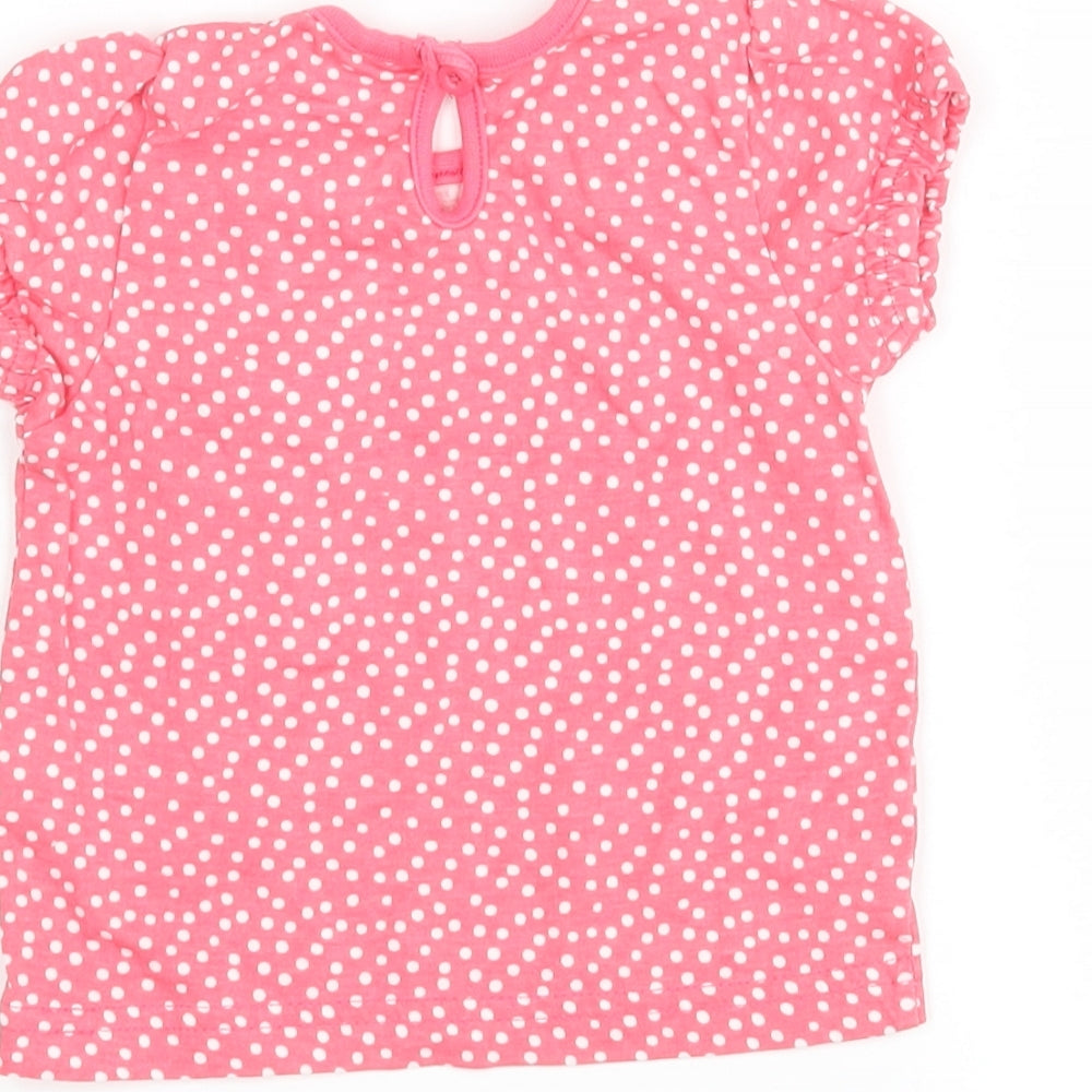 Brand and care label for F&F girls’ pink polka dot basic t-shirt, size 3-6, months