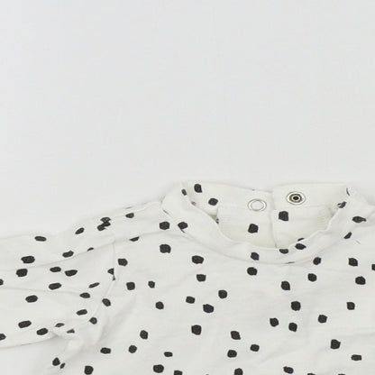 Close-up detail of Nutmeg girls’ white geometric basic t-shirt, size 0-3, months