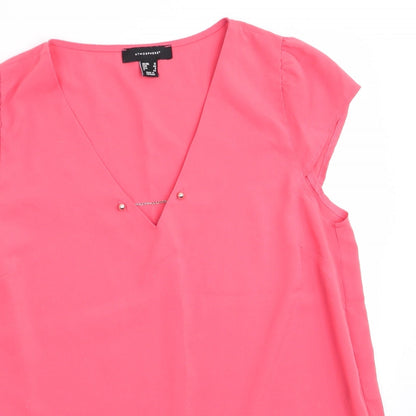 Close-up detail of Atmosphere women’s orange basic blouse, size UK 12