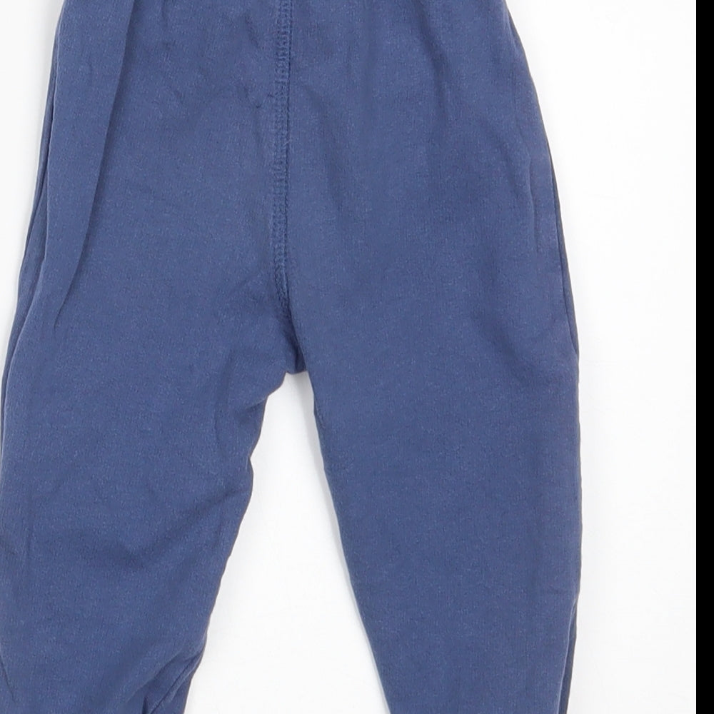 Brand and care label for Urban Adventure boys’ blue jogger trousers, size 12-18, months - waist 16in; inside leg 10in