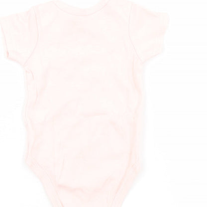 Brand and care label for chick pea girls’ pink babygrow one-piece, size 3-6, months