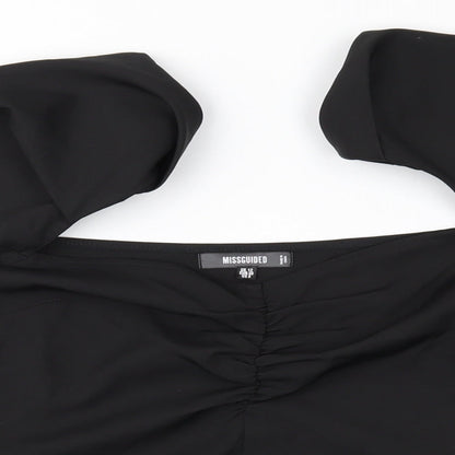 Close-up detail of Missguided women’s black basic blouse, size UK 12