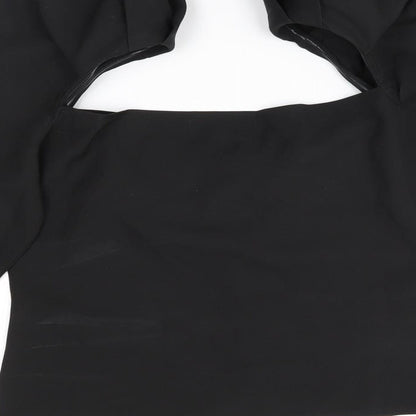 Brand and care label for Missguided women’s black basic blouse, size UK 12