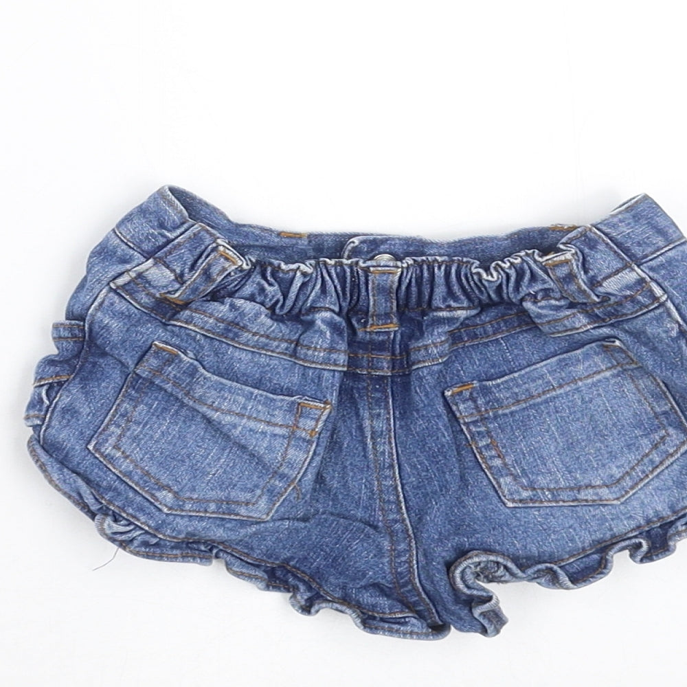 Brand and care label for Early Days girls’ blue denim trousers, size 6-9, months - hotpants