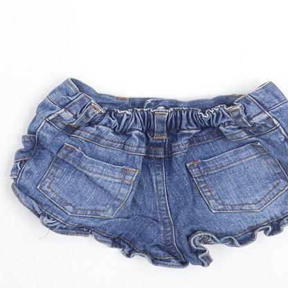 Brand and care label for Early Days girls’ blue denim trousers, size 6-9, months - hotpants