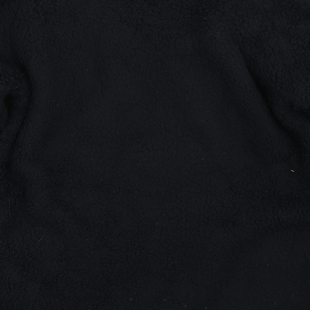 Brand and care label for TOG24 boys’ black jacket, size 11-12, years