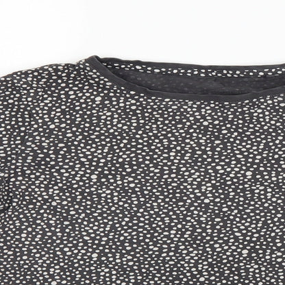 Close-up detail of Next girls’ black spotted basic t-shirt, size 11, years