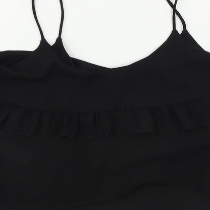 Brand and care label for New Look girls’ black basic blouse, size 11, years