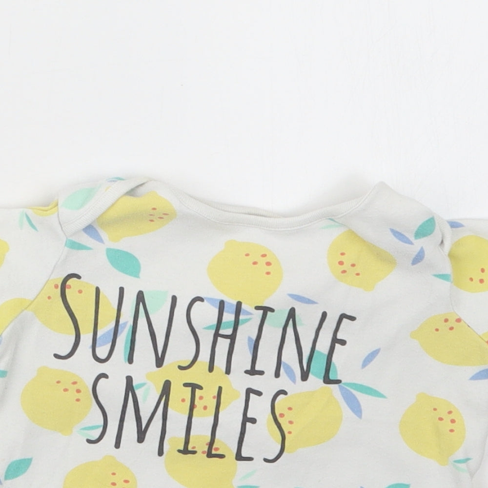Close-up detail of F&F girls’ yellow geometric basic t-shirt, size 2-3, years