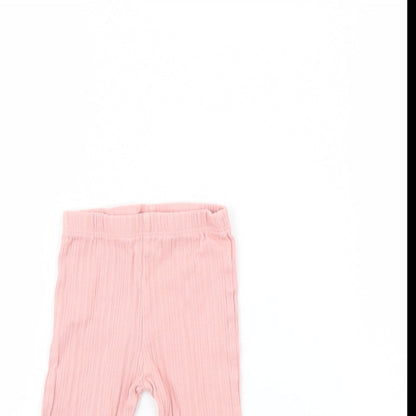 Close-up detail of F&F girls’ pink capri trousers, size 6-9, months