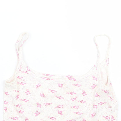 Close-up detail of Dunnes women’s white floral basic tank, size UK 10
