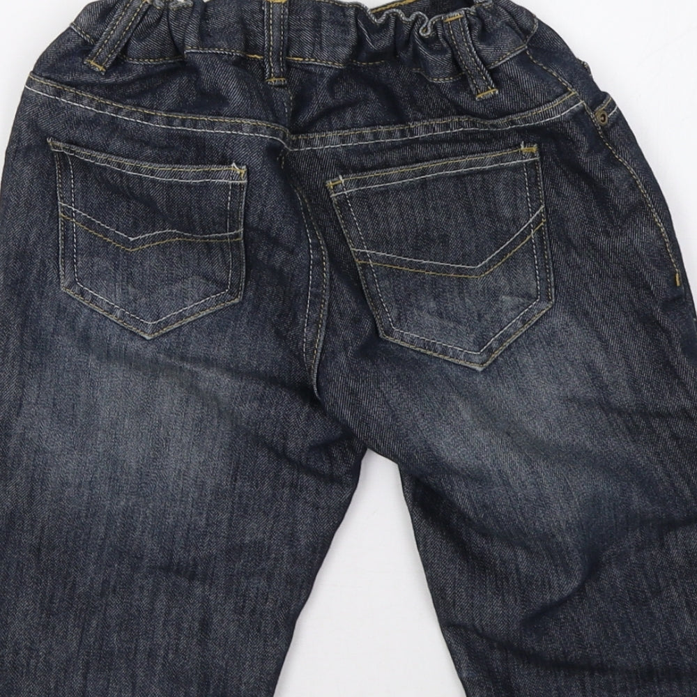 Brand and care label for Urban Outlaws boys’ blue denim straight jeans, size 9, months