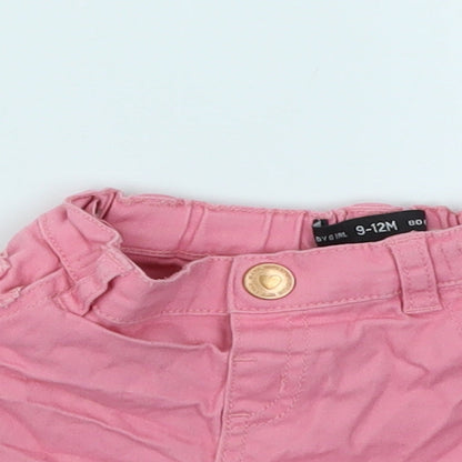 Close-up detail of BABY GILR girls’ pink capri jeans, size 9-12, months