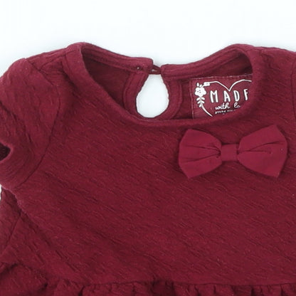 Close-up detail of Young Dimension girls’ red basic t-shirt, size 3-6, months