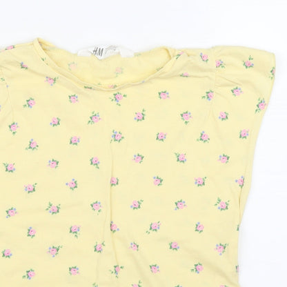 Close-up detail of H&M girls’ yellow floral basic t-shirt, size 7, years