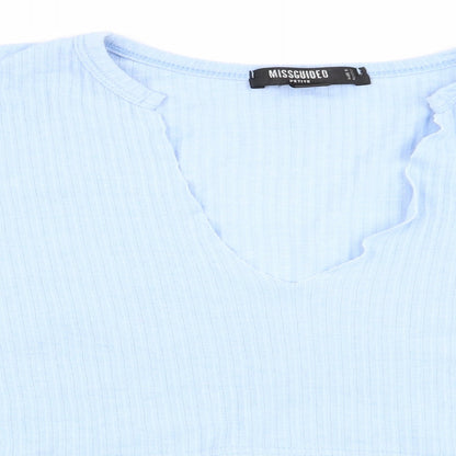 Close-up detail of Missguided women’s blue cropped t-shirt, size UK 12