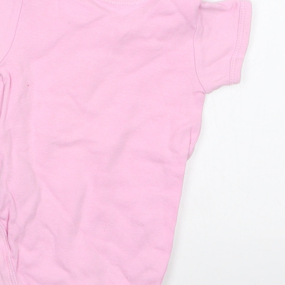 Brand and care label for Early Days girls’ pink babygrow one-piece, size 0-3, months