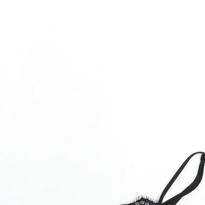 Close-up detail of Missguided women’s black basic tank, size UK 6