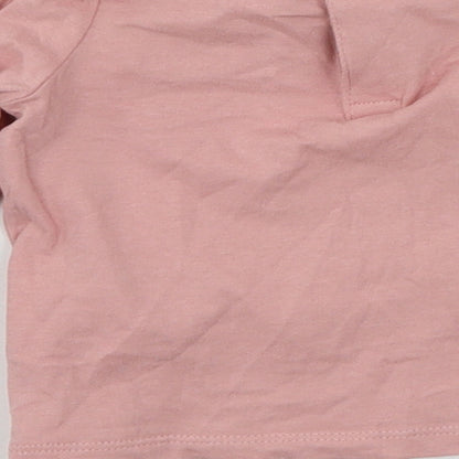 Brand and care label for F&F girls’ pink jersey basic t-shirt, size 0-3, months