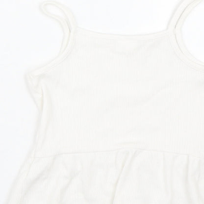 Brand and care label for F&F girls’ white basic tank, size 6-7, years