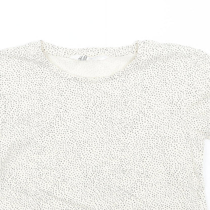 Close-up detail of H&M girls’ beige polka dot basic t-shirt, size 5, years