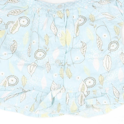 Brand and care label for Matalan girls’ blue floral basic blouse, size 3-6, months