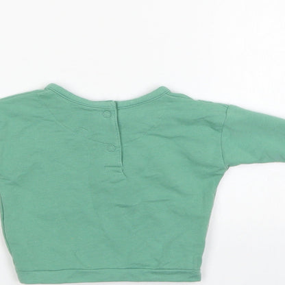 Brand and care label for Marks & Spencer Baby Green jumper, size 0-3, Months