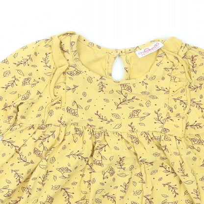 Close-up detail of SO CUTE girls’ yellow animal print fit & flare, size 9-12, months
