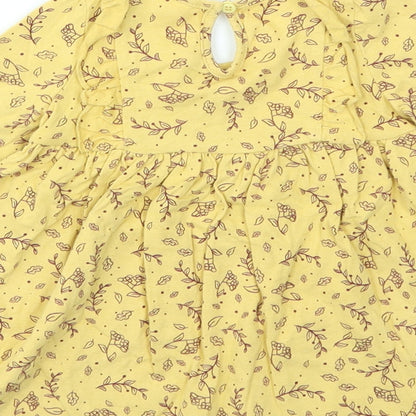 Brand and care label for SO CUTE girls’ yellow animal print fit & flare, size 9-12, months