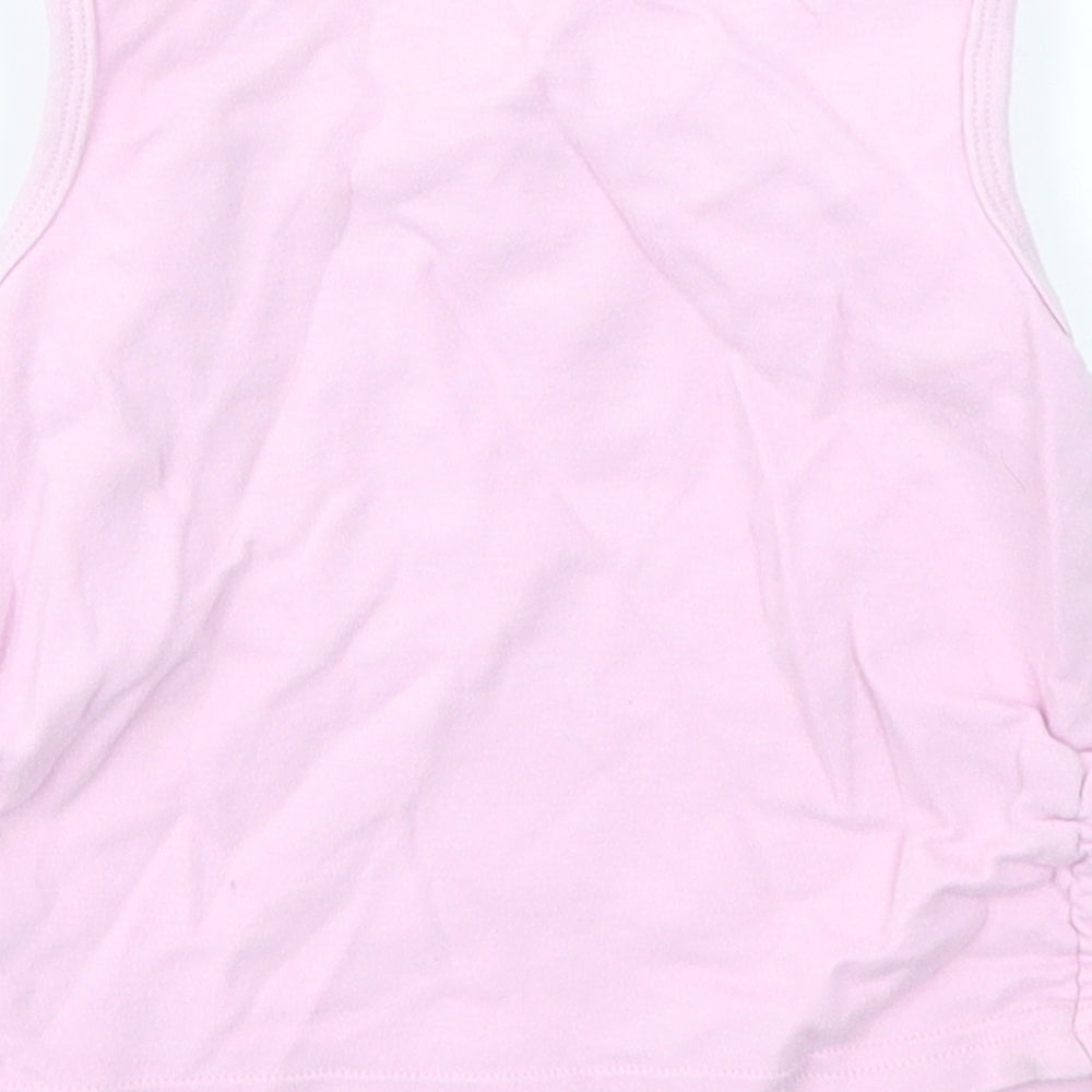 Brand and care label for Cherokee girls’ pink camisole t-shirt, size 2-3, years