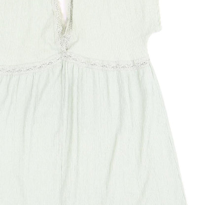 Brand and care label for ASOS women’s green polyester shift, size UK 16, v-neck pullover - lace trim