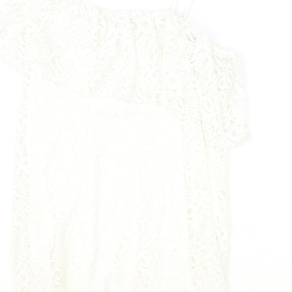 Brand and care label for River Island girls’ ivory polyester basic blouse, size 11-12, years off the shoulder pullover