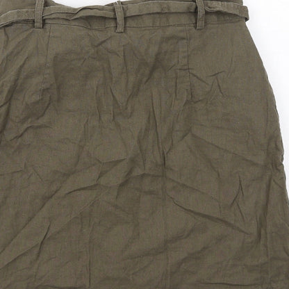 Brand and care label for ASOS women’s green cotton a-line skirt, size UK 10, regular button