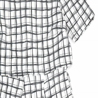 Close-up detail of ASOS women’s white check polyester shift, size UK 12, round neck zip