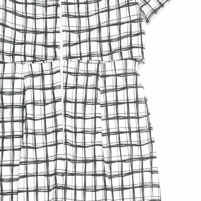 Brand and care label for ASOS women’s white check polyester shift, size UK 12, round neck zip