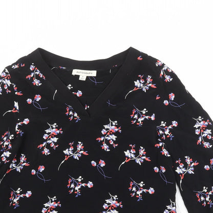 Close-up detail of Autograph women’s black floral cupro basic blouse, size UK 6, v-neck