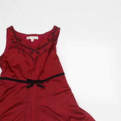 Close-up detail of Autograph girls’ red floral polyester fit & flare, size 5, years v-neck zip