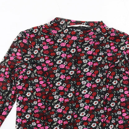 Close-up detail of Marks & Spencer girls’ black floral polyester basic t-shirt, size 10-11, years mock neck pullover