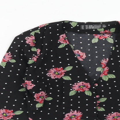 Close-up detail of Missguided women’s black geometric polyester basic blouse, size UK 6, v-neck