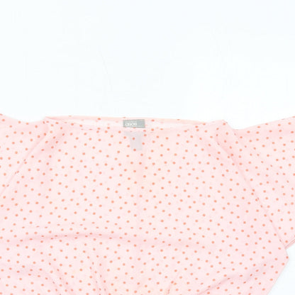 Close-up detail of ASOS women’s pink polka dot polyester basic blouse, size UK 6, off the shoulder - shirred