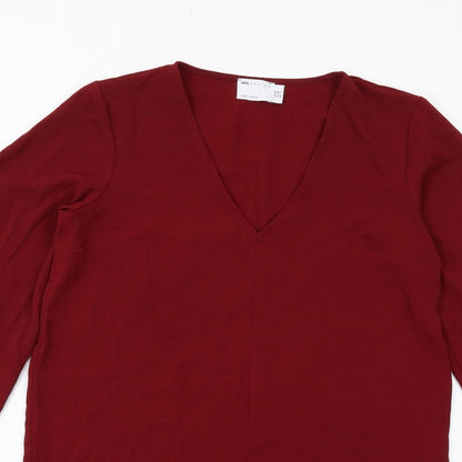 Close-up detail of ASOS women’s red polyester mini, size UK 10, v-neck pullover