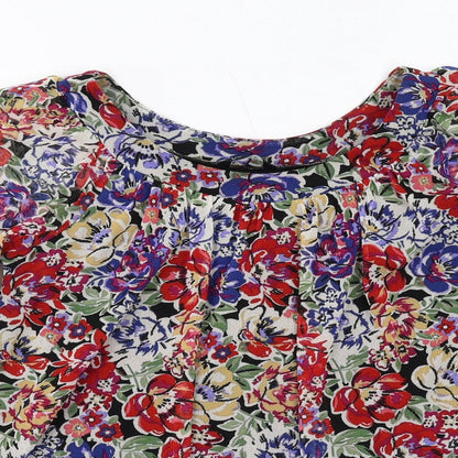 Close-up detail of Dunnes women’s multicoloured floral polyester basic blouse, size UK 8, round neck