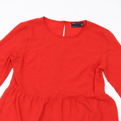 Close-up detail of ASOS women’s red polyester a-line, size UK 12, round neck button