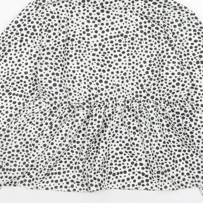 Brand and care label for I SAW IT FIRST women’s white animal print polyester basic blouse, high neck - dalmatian print