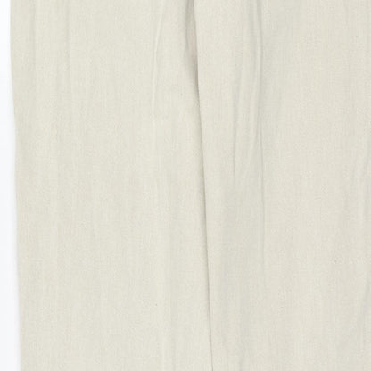 Brand and care label for Missguided women’s beige cotton mom jeans, size UK 12, regular zip