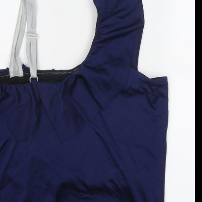 Brand and care label for ASOS women’s blue polyester basic blouse, size UK 24, one shoulder