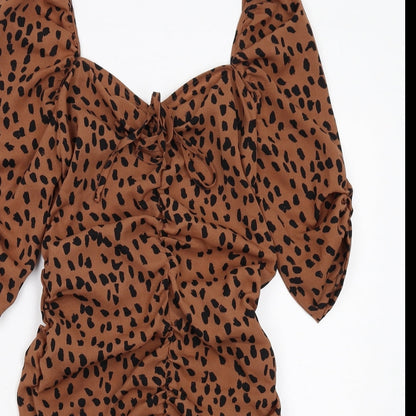 Close-up detail of I SAW IT FIRST women’s brown geometric polyester bodycon, size UK 10, v-neck zip