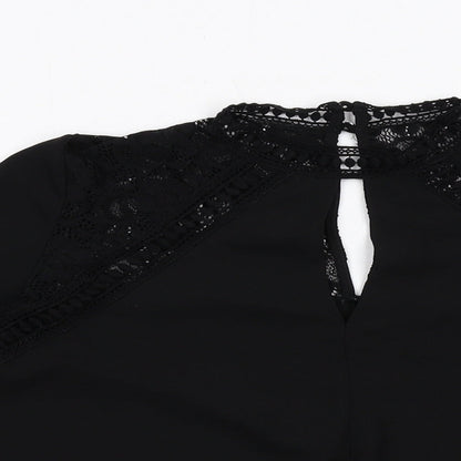 Close-up detail of Miss Selfridge women’s black polyester basic blouse, size UK 10, v-neck - flute sleeve lace detail
